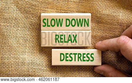 Destress Symbol. Concept Words Slow Down Relax Destress On Wooden Blocks. Beautiful Canvas Table Can
