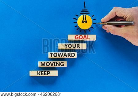 Keep Moving Toward Your Goal Symbol. Wooden Blocks With Words Keep Moving Toward Your Goal. Light Bu
