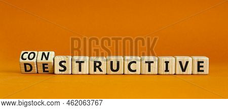 Destructive Or Constructive Symbol. Turned Wooden Cubes And Changed The Concept Word Destructive To 