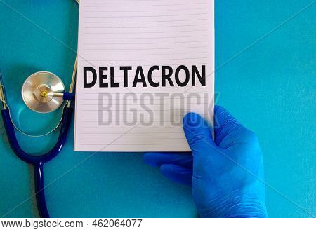 New Covid-19 Deltacron Variant Strain Symbol. Hand In Blue Glove With White Note. Concept Words Delt
