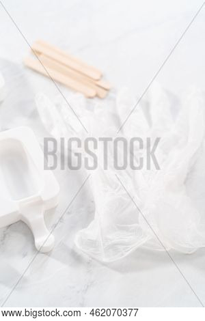 Filling Silicone Molds With Cake Crumbs To Prepare Mermaid Cakesicles.