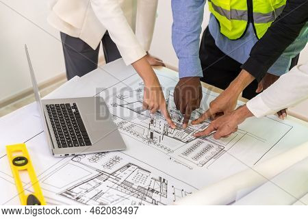 Team Engineers With Draft Plan Of Building On Constructing Site. Engineer Work On Site. Engineer Vis