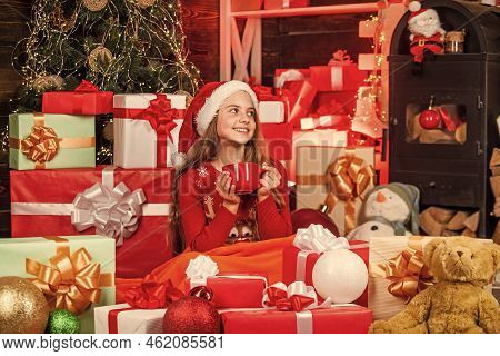 Expecting Santa. Christmas Sale. Santa Helper Drink Milk. Smiling Shop Assistant. Kid In Santa Hat W