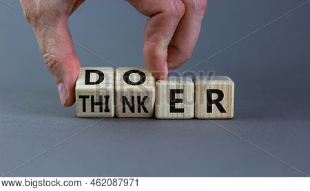 Doer Or Thinker Symbol. Concept Words Doer Or Thinker On Wooden Cubes. Businessman Hand. Beautiful G
