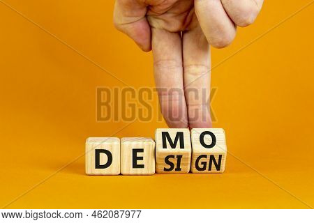 Demo And Design Symbol. Businessman Hand Turns Cubes And Changes The Word 'design' To 'demo'. Beauti