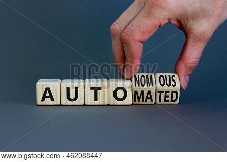 Autonomous Or Automated Vehicle Symbol. Businessman Turns Cubes And Changes Words Autonomous To Auto