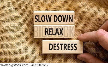 Destress Symbol. Concept Words Slow Down Relax Destress On Wooden Blocks. Beautiful Canvas Table Can