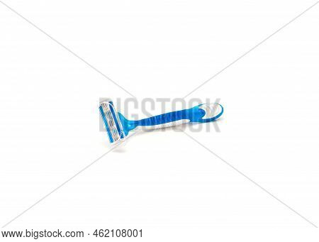 Single Brand New Blue And White Plastic Disposable Razor With Ergonomic Handle Isolated On White Bac