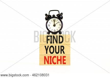 Find Your Niche Symbol. Concept Words Find Your Niche On Wooden Blocks. Black Alarm Clock. Beautiful