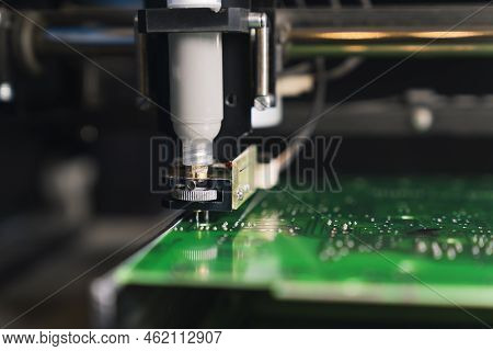Horizontal Closeup Indoor Shot Of A Soldering Paste Dispenser Machine In Use. Soldering Multi-pin Sm