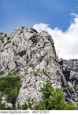 Paklenica, Croatia, Eu - June 25, 2022: Distant View Of Mountain Climbers In National Park Paklenica
