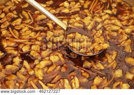 Fish Maw In A Ladle. Background Of Chinese Style Braised Fish Maw With Shiitake Mushrooms In Thick G