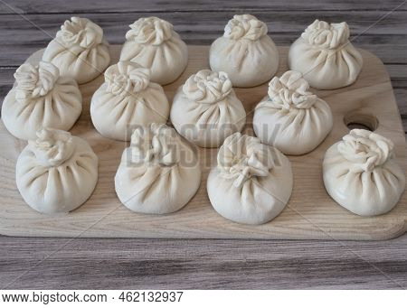 Frozen Raw Dumplings Khinkali With Beef And Lamb Meat Set. Traditional Georgian Raw Frozen Khinkali 
