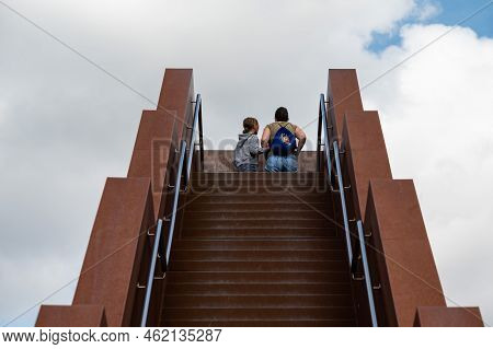 Tielt-winge, Flemish Brabant, Belgium,  08 22 2022 - Mother And Daughter At An Observation Staircase