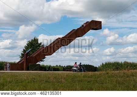 Tielt-winge, Flemish Brabant, Belgium,  08 22 2022 - Green Meadows And Observation Stairs Aginst Blu