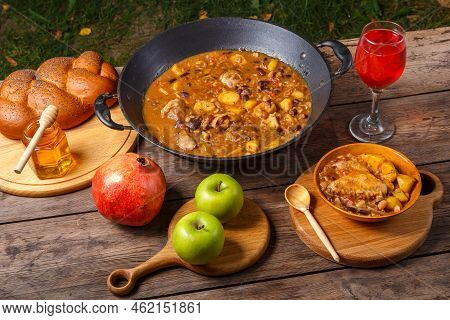 Festive Table For Rosh Hashanah Cholent, Pomegranate, Wine, Honey, Apples, Challah Horizontal Photo