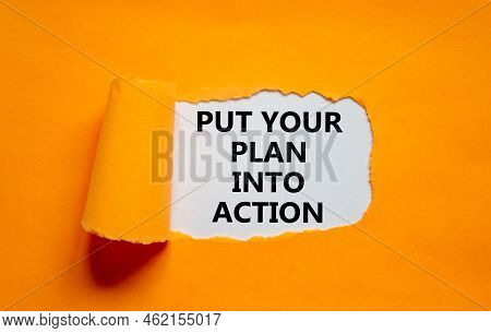 Put Your Plan Into Action Symbol. Concept Words Put Your Plan Into Action On White Paper On A Beauti
