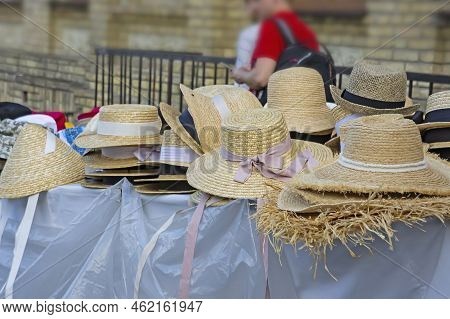 Market Stall With Straw Hats. Big Group Of Authentic Panama Hats Or Paja Toquilla Hats Made From Str