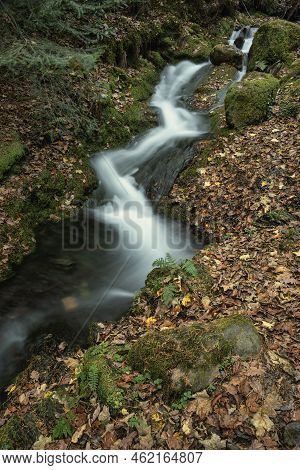 Beautiful Waterfall Landscape Image In Vibrant Autumn Woodland In Lake District