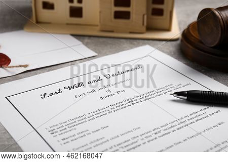 Last Will And Testament Near House Model, Gavel On Light Grey Table, Closeup