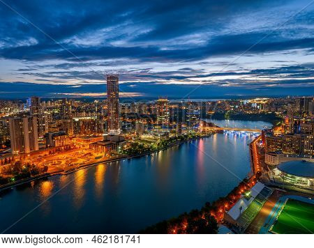 Yekaterinburg City And Pond Aerial Panoramic View At Summer Or Early Autumn Night. Night City In The