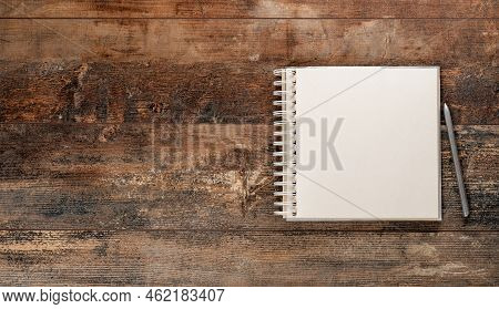 Vintage Sketchbook With Pen And Pen On Old Rustic Wooden Table. Mockup Blank Notebook And Pen On Old