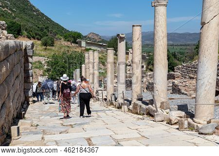 Turkey - June 4, 2021: Unidentified Tourists Stroll Along The Former Curetes Street In The Ruins Of 
