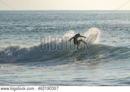 Surfer Riding Waves