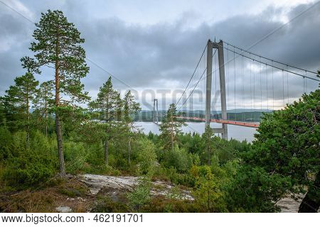 Hogakustenbron, Suspension Bridge In The High Coast Area In Sweedn On A Cloudy Day. Hoga Kusten Trai