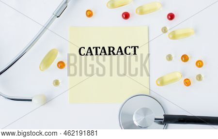 Card Text Cataract A Pills And Stethoscope. Medical Concept.