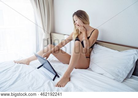 Young Sexy Woman Posing In Front Of Camera And Working As Webcam Model