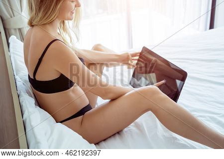 Young Sexy Woman Posing In Front Of Camera And Working As Webcam Model