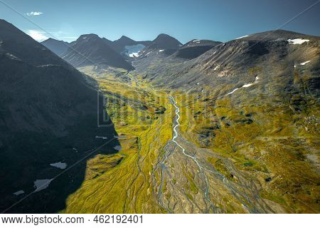 Wild River Flowing From Mountain Glaciers In Vast Remote Arctic Landscape. Mountains In Sarek Nation