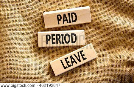 Paid Period Leave Symbol. Concept Words Paid Period Leave On Wooden Blocks. Beautiful Canvas Table C