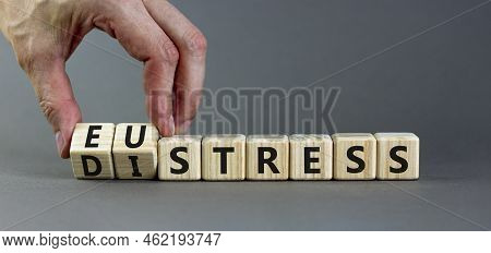 Eustress Or Distress Symbol. Psychologist Turns Cubes And Changes The Concept Word Eustress To Distr
