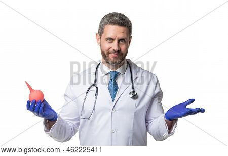 Puzzled Doctor Hold Clyster Isolated On White. Clyster For Medical Procedure. Nurse Man With Clyster