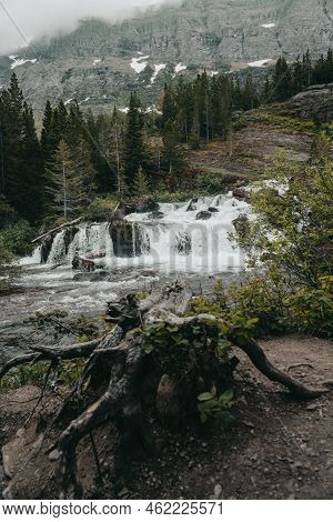 Redrock Falls Waterfall In Glacier National Park Along The Swiftcurrent Pass Trail
