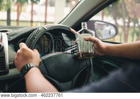Man Drinking Alcohol While Driving In His Car
