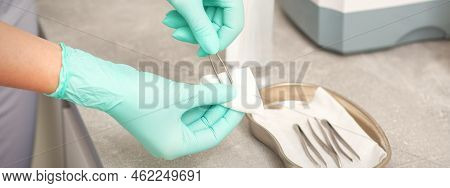 Hand Disinfects Tweezers With Cleaning Systems For Medical Instruments. Ultrasonic Cleaner