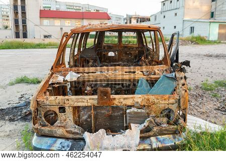 Damaged And Destroyed Civilian Car With Shrapnel Holes From Russian Missile In A War Zone In Kharkiv