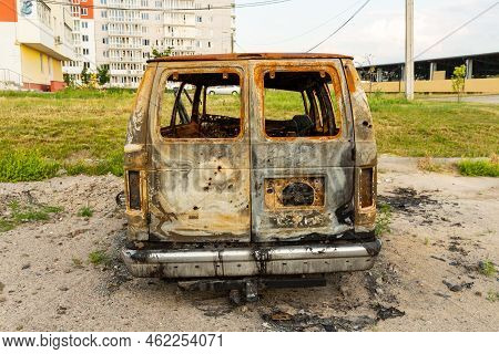 Damaged And Destroyed Civilian Car With Shrapnel Holes From Russian Missile In A War Zone In Kharkiv