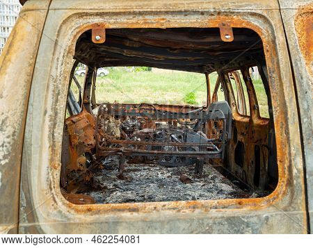 Damaged And Destroyed Civilian Car With Shrapnel Holes From Russian Missile In A War Zone In Kharkiv
