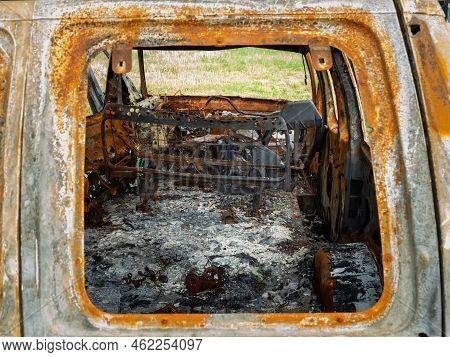 Damaged And Destroyed Civilian Car With Shrapnel Holes From Russian Missile In A War Zone In Kharkiv