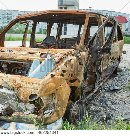 Damaged And Destroyed Civilian Car With Shrapnel Holes From Russian Missile In A War Zone In Kharkiv