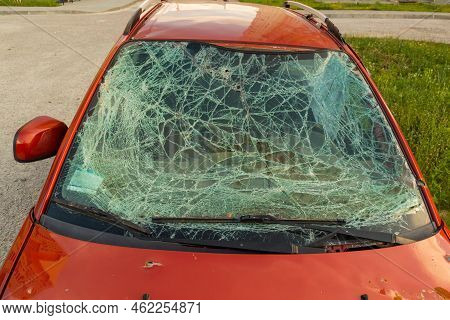 Burnt , Damaged And Destroyed Civilian Car With Shrapnel Holes From Russian Missile In A War Zone In