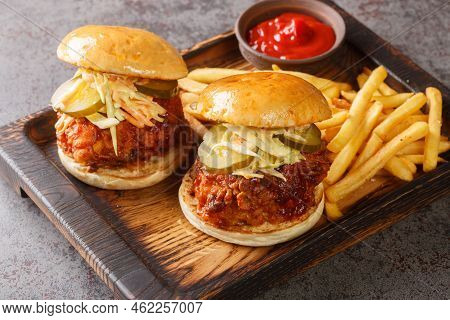 Nashville Hot Chicken Is A Deep-fried Chicken Slathered In A Spicy Paste And Served On Bun With Pick