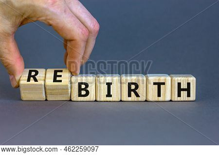 Birth Or Rebirth Symbol. Businessman Turns Wooden Cubes And Changes The Word Birth To Rebirth. Beaut