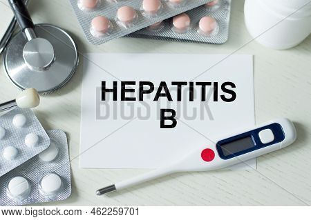 Blue Card With Text Hepatitis B On A Table With A Pills And Pencil, Medical Concept, Top View