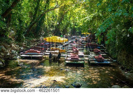 Ulupinar, Turkey - September 9, 2022: Tropic Restaurants On The River. Places On The River With Tour