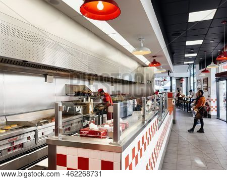 Paris, France - Sep 21, 2022: Perspective View Over Five Guys American Fast Food Restaurant Chain Wi